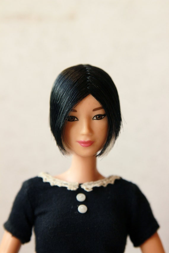 barbie doll with short black hair
