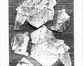 May include: A vintage knitting pattern from Patons, featuring a baby's sweater, hat, and booties. The pattern is for double knitting and fits babies aged 6 months to 2 years, with chest sizes from 18 to 20 inches. The image is in black and white.