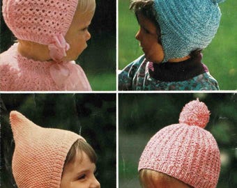 May include: Vintage baby knitting pattern featuring four different knitted hats in pink and blue. The hats include a bonnet, a cap with ear flaps, and a ribbed hat with a pom-pom. The text reads "PATONS" and "Baby Colourglow Quickerknit".
