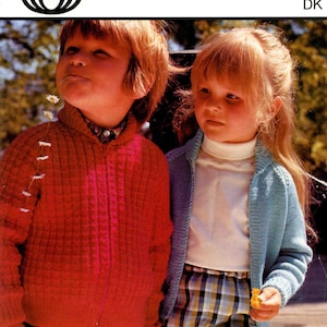 May include: Vintage Sirdar knitting pattern cover featuring two children. One child wears a red zip-up sweater, the other a blue cardigan. The pattern number is 4159, with sizes 22-24 inches. The Sirdar logo is at the top left.