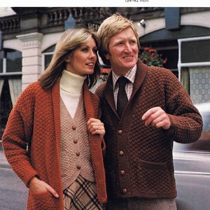 May include: Two people wearing brown knit cardigans with button closures. The cardigan on the left has a pocket on the front. The cardigan on the right has a pocket on the left side. The text "Peter Green" is at the top of the image. The text "CHUNKYKNIT and DOUBLE KNITTING" is also at the top of the image. The text "TO FIT SIZES 86-107 cm CHEST (34-42 inch)" is below the text "CHUNKYKNIT and DOUBLE KNITTING". The text "435" is at the top right of the image.