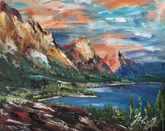 May include: A painting of a mountain lake scene with a blue lake, green trees, and red, orange, and yellow mountains in the background. The sky is a mix of blue, orange, and white.