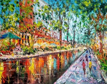 May include: A colorful oil painting of a canal scene with buildings on one side and trees on the other. The canal is reflecting the colors of the buildings and trees. There are people walking along the canal path.