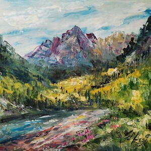 May include: A painting of a mountain valley with a river running through it. The mountains are a deep purple color, and the valley is covered in green and yellow trees. The river is a bright blue color, and there are pink flowers in the foreground.