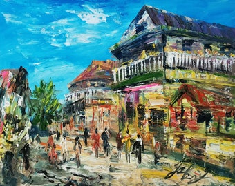 May include: A colorful oil painting depicting a street scene with buildings and people walking. The buildings are painted in shades of yellow, red, green, and blue. The people are painted in shades of brown, red, and blue. The sky is painted in shades of blue and white.