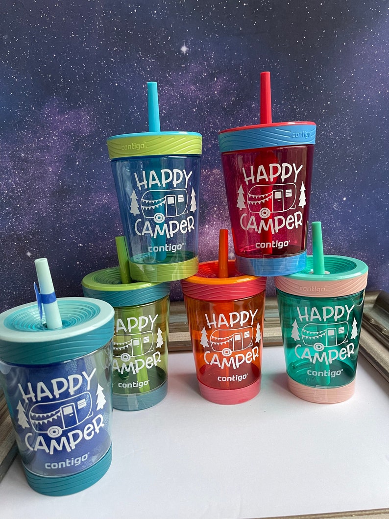 May include: Five colorful, reusable water bottles with straws. Each bottle has a different color and features a white graphic of a camper with the text "Happy Camper" and the brand name "contigo".