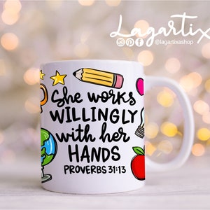 May include: White ceramic mug with a colorful design featuring a pencil, lightbulb, globe, apple, and stars. The text on the mug reads "She works willingly with her hands Proverbs 31:13".