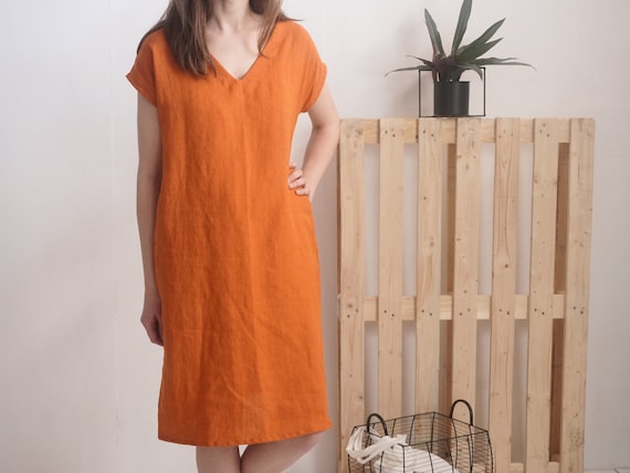 white linen dress button down White linen shirt dress with mother of pearl buttons and pockets