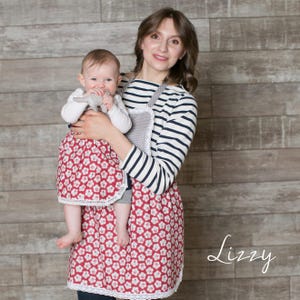 Toddler and mum wearing matching red polka dot aprons, mother and daughter set.