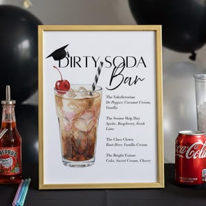 May include: A framed sign with the words "DIRTY SODA Bar" and a watercolor illustration of a cocktail with a cherry. The sign lists drink recipes like "The Valedictorian" and "The Senior Skip Day." A Coca-Cola can and a bottle of soda are also visible.