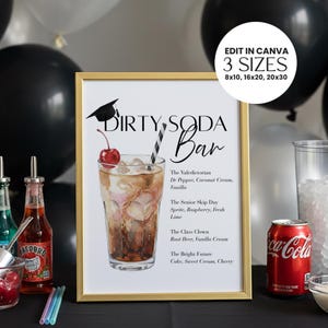 May include: A framed "Dirty Soda Bar" sign with a gold frame. The sign features a watercolor illustration of a soda drink with a cherry and a straw. Text includes drink names and ingredients. The sign is available in 3 sizes.