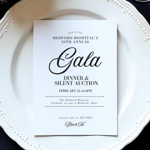 May include: A black and white invitation to a gala dinner and silent auction hosted by Medford Hospital. The event is on 21st February at 6 PM at The Medford Mansion in Medford, Ohio. The dress code is black tie.