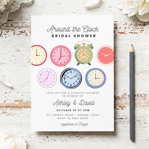 May include: White invitation card with the text "Around the Clock BRIDAL SHOWER". The invitation features colorful clock illustrations and details for Ashley & David's couples shower, including the date, time, and location.