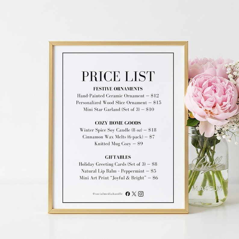 May include: A framed price list with festive ornaments, cozy home goods, and giftables. The list includes items like hand-painted ceramic ornaments, candles, and greeting cards. A bouquet of pink flowers sits to the right.