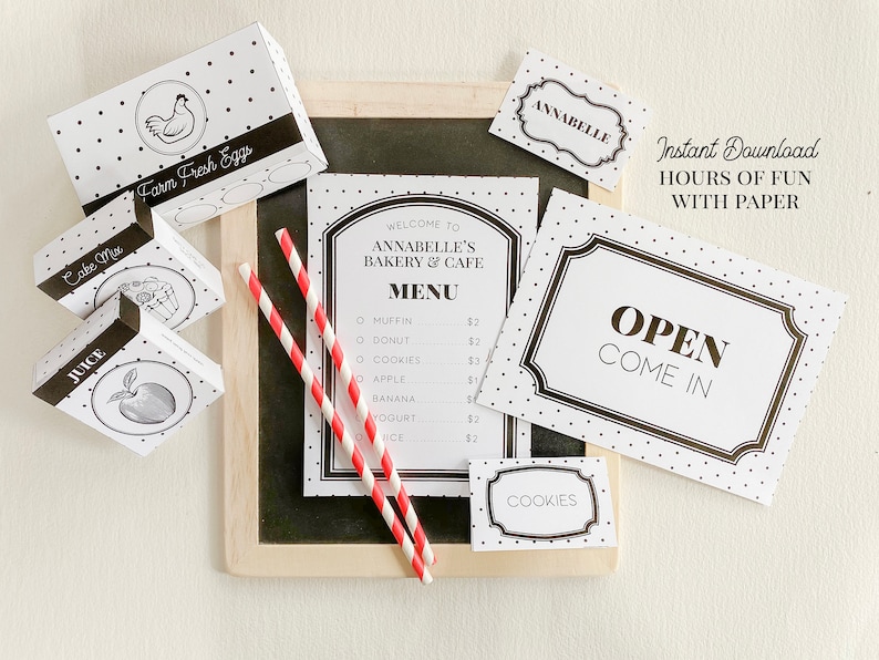 May include: A printable set of black and white bakery themed party decorations with polka dots. The set includes a menu, an open sign, a price tag for cookies, a sign that says "Farm Fresh Eggs", and a sign that says "Annabelle's Bakery & Cafe".