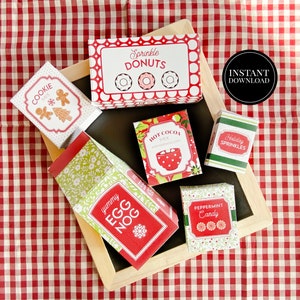 May include: Printable Christmas gift box templates for cookie mix, hot cocoa mix, egg nog, peppermint candy, holiday sprinkles, and sprinkle donuts. The boxes are red, green, and white with festive designs.