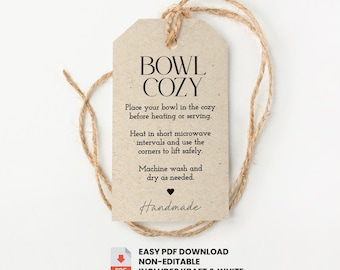 May include: A rectangular kraft paper tag with rounded top corners and a jute twine loop. The text reads: BOWL COZY, Place your bowl in the cozy before heating or serving, Heat in short microwave intervals and use the corners to lift safely, Machine wash and dry as needed, Handmade.