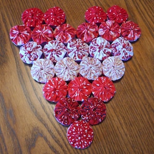 Reversible Rojo Rosa y Púrpura Yoyo Trivet