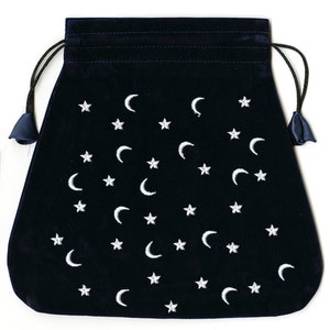 May include: A dark blue velvet pouch with a drawstring closure. The pouch is decorated with a white embroidered pattern of stars and crescent moons.