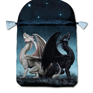 May include: A black and white dragon drawstring bag with a starry night sky design. The bag is made of satin and has a drawstring closure.