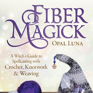 May include: A book titled "Fiber Magick: A Witch's Guide to Spellcasting with Crochet, Knotwork & Weaving" by Opal Luna, featuring a crocheted witch's hat with a pentagram charm.