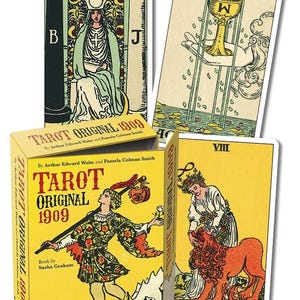 May include: A Tarot deck with a yellow box and several cards. The box reads "TAROT ORIGINAL 1909" and features illustrations. The cards show detailed artwork with figures, symbols, and the words "STRENGTH" and "VIII".