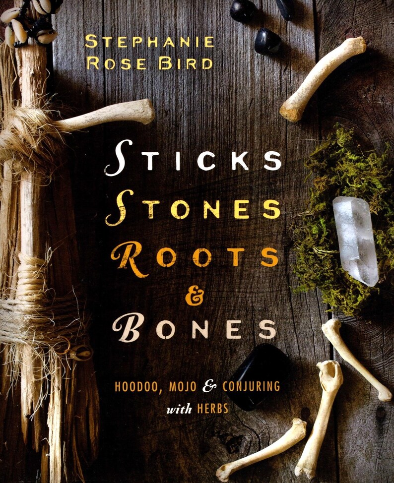 May include: A book cover with the title "STICKS STONES ROOTS & BONES" and the author's name, Stephanie Rose Bird. The cover features a wooden background with bones, crystals, and moss. The subtitle reads "HOODOO, MOJO & CONJURING with HERBS."