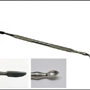 Pode incluir: Uma ferramenta de metal prateado com uma ponta pontiaguda e uma ponta arredondada. A ferramenta é usada para raspar e limpar.