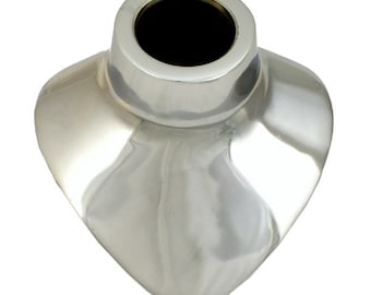 May include: Silver necklace display stand with a heart-shaped base and a round top opening. The stand is made of metal and has a shiny finish.