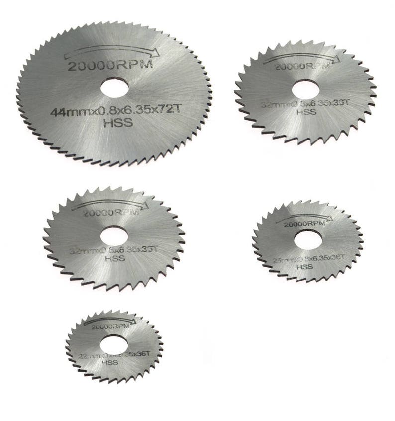 May include: Set of five silver circular saw blades with different sizes and tooth counts. The blades are labeled with the text "20000RPM" and specifications such as "44mmx0.8x6.35x72T HSS".