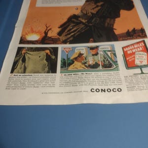 May include: A vintage Conoco motor oil advertisement featuring a soldier in a military uniform with the text "Nylon armor saved him!" and "50,000 Miles No Wear!" The ad also includes a depiction of a car engine and a car with the text "Conoco Sure" and "Give your car the extra protection of Conoco Sure - now available from coast to coast!"
