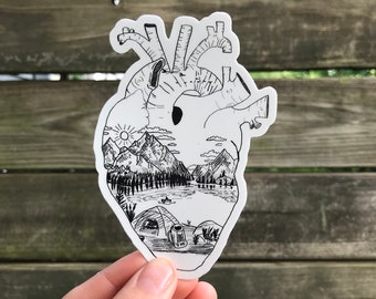 Anatomical heart full of adventure. Adventure sticker. Hand drawn sricker. Camping sticker. Travel sticker. Mountains sticker.