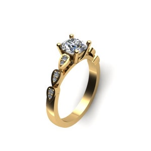 May include: A gold engagement ring with a large oval-shaped diamond in the center and smaller diamonds set in the band.