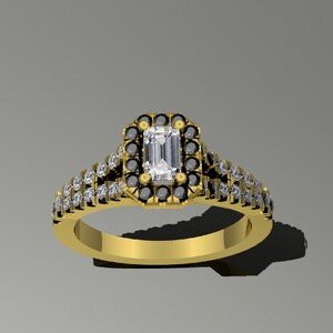 May include: A gold engagement ring with a large, rectangular, clear center stone surrounded by a halo of smaller black stones. The band is set with smaller clear stones.