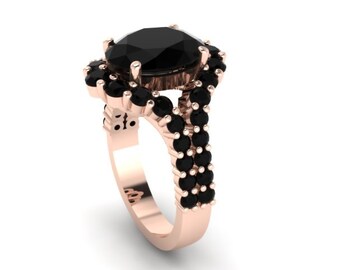 May include: A rose gold engagement ring with a large oval black diamond surrounded by a halo of smaller black diamonds. The band is split and features two rows of black diamonds.
