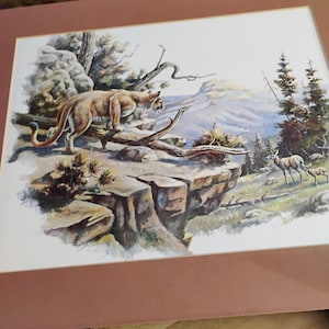 dipinto originale di Lowell Davis.Leone di montagna a caccia di cervi 1971