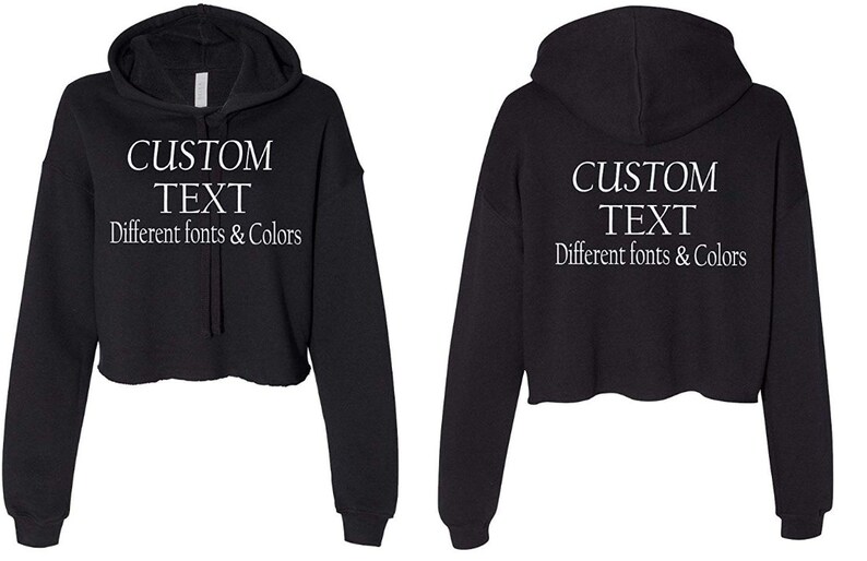May include: Black cropped hoodie with a drawstring hood. The hoodie has white text that says "CUSTOM TEXT Different fonts & Colors".