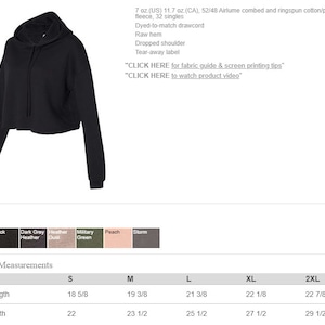 May include: Black cropped hoodie with a drawstring. The hoodie has a tear-away label and a dropped shoulder. The size chart shows measurements in inches.