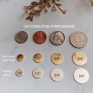 May include: A sizing chart for metal discs featuring rows of 14k yellow gold filled and sterling silver circles in 3/8 inch, 1/2 inch, 5/8 inch, and 3/4 inch diameters. US coins are included for scale with text labels DISC SIZING and US COINS FOR COMPARISON.