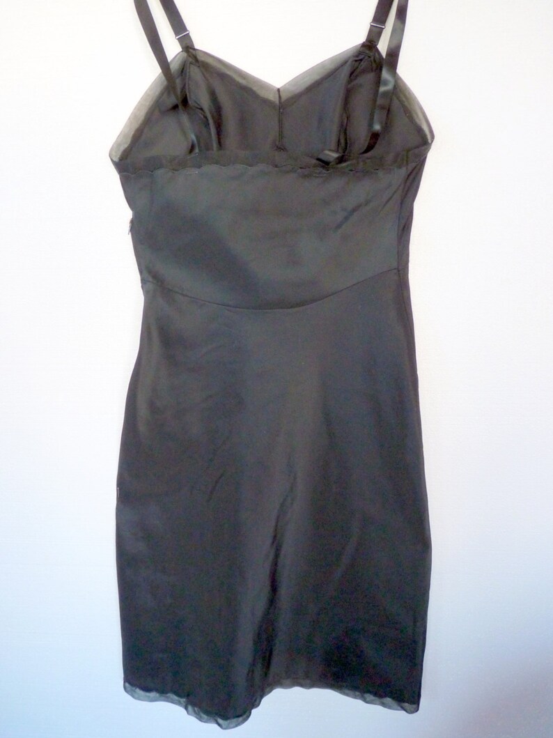 A Vintage 1960's Era Dress Slip, White Nylon, Silk and Dacron Polyester Blend With Lace Trim
