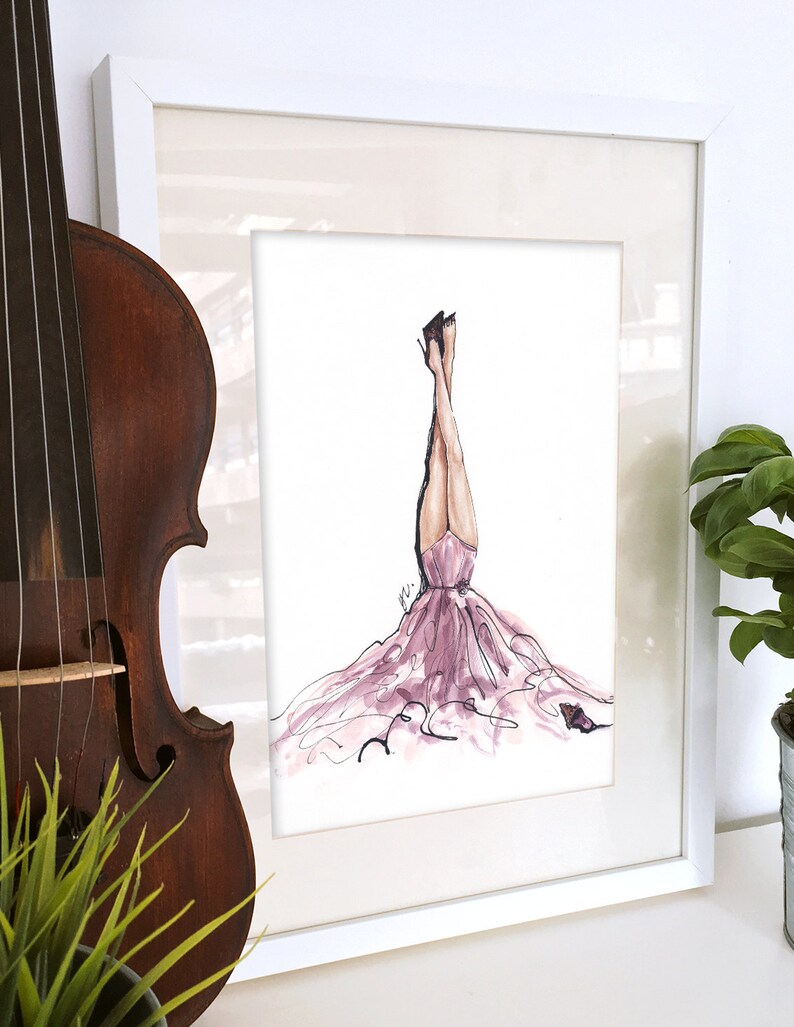 May include: A framed illustration of a woman in a pink gown with her legs in the air. The woman is wearing black heels and there is a small butterfly on the ground.
