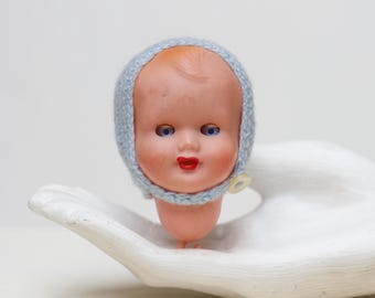 Vintage Doll Head – 1960s Plastic Baby, Sleepy Eyes, Blue Crochet Bonnet