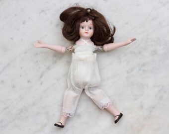Vintage 8 Inch Bisque China Doll – Flexible Articulated Brunette