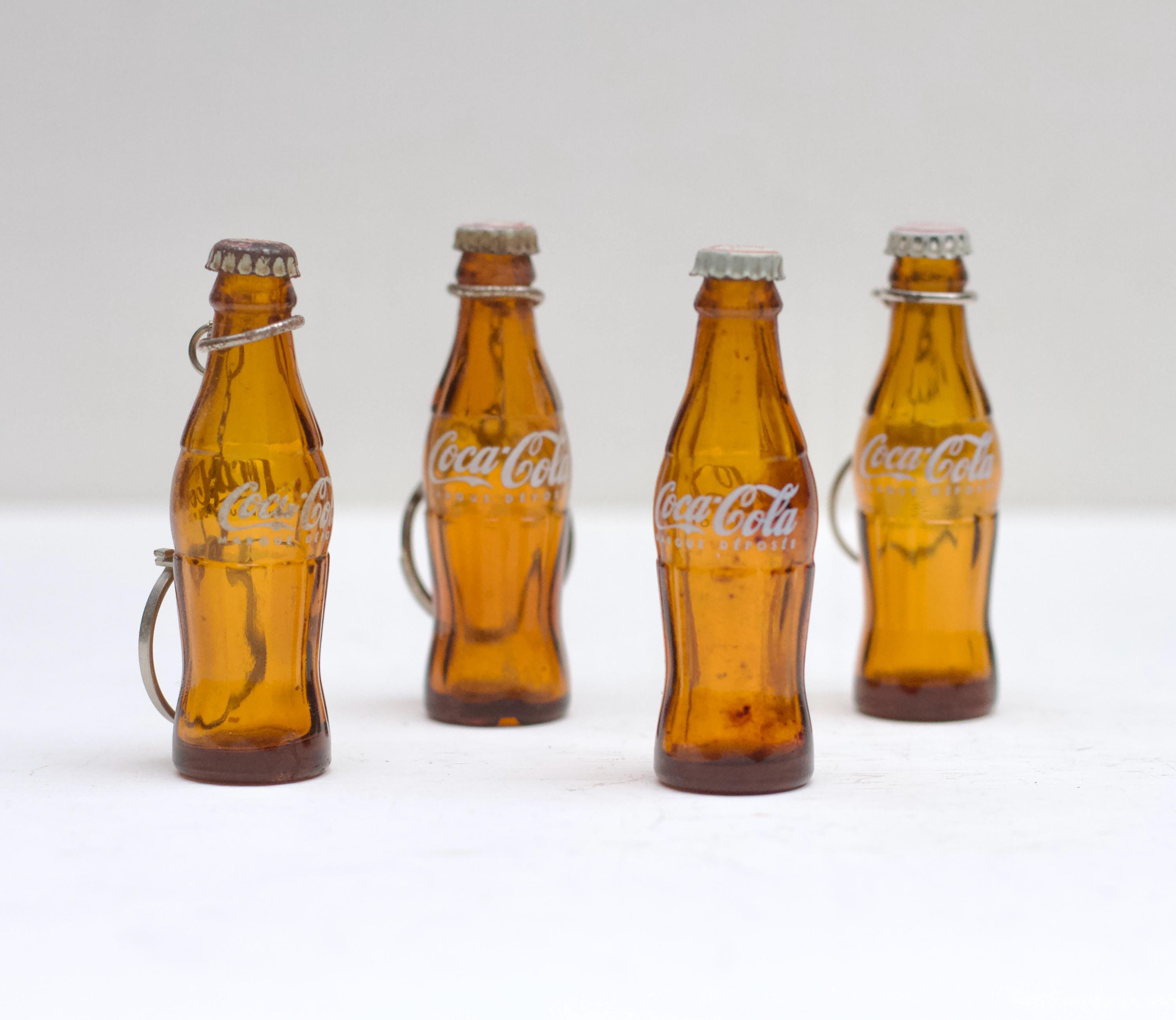 琥珀色のヴィンテージミニチュアコカコーラボトル1本 - 茶色のガラス