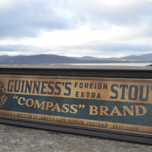 old guinness sign, compass guinness antique look painted sign