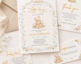 May include: A baby shower invitation set featuring a watercolor teddy bear and floral arch design. The text reads Our Little Honey Is On The Way, Laura Carpenter, 19 | 25 | 5PM, 1234 10th Sideroad, Santa Monica, CA 3456, RSVP to Melissa, and Registered at Amazon and Target.
