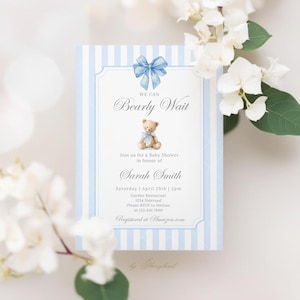 May include: A baby shower invitation with a blue bow and a teddy bear illustration. The invitation has blue and white stripes and includes the text "We Can Bearly Wait" and details for Sarah Smith's baby shower.