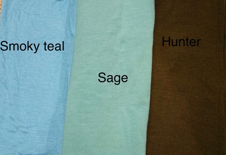 May include: Three fabric swatches in shades of blue, green, and brown. The colors are labeled "Smoky teal", "Sage", and "Hunter". The fabric appears to be a soft, textured material.