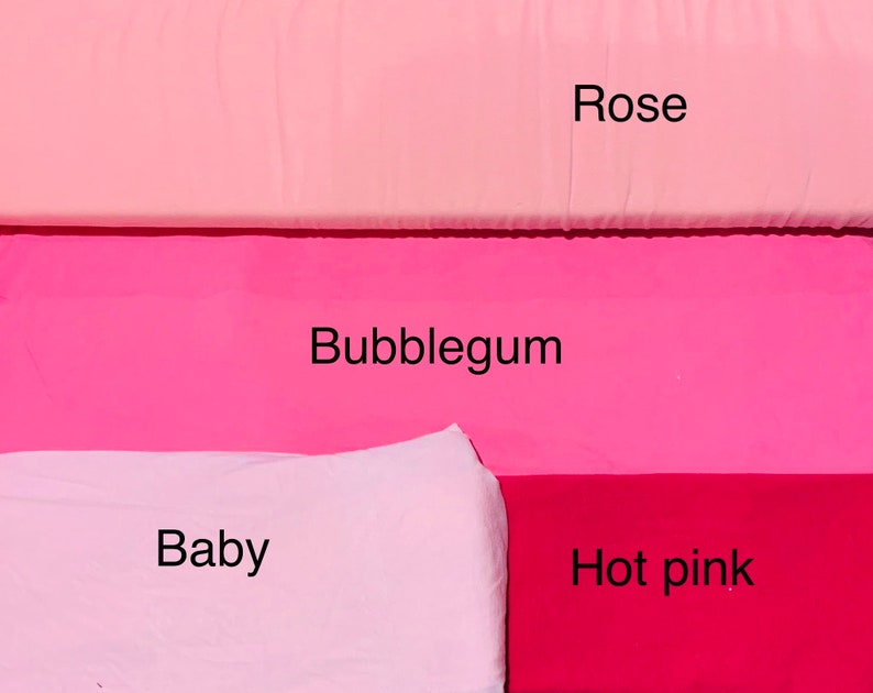 May include: A color palette featuring fabric swatches in shades of pink. The colors are labeled "Rose," "Bubblegum," "Baby," and "Hot pink." The fabrics are arranged in horizontal bands, showcasing the range of pink hues.
