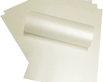 May include: A roll of ivory cardstock paper, with a smooth, glossy finish. The paper is rolled up and the ends are visible.